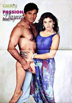 the man and woman are posing together for a magazine cover photo, which features an image of