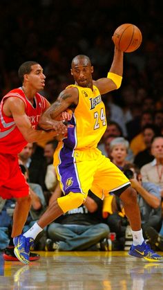 two basketball players in action on the court