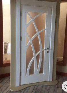 a white door with an intricate design on it