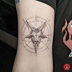 a tattoo with a goat head on it