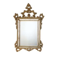 an ornate gold framed mirror against a white wall