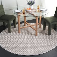 a round glass table with chairs around it