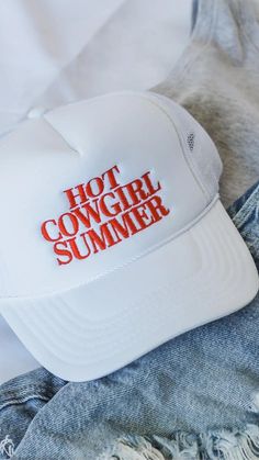 Hot Cowgirl Summer! Saddle up for the hottest season yet with the Hot Cowgirl Summer hat! So go ahead, channel your inner cowgirl and ride into the summer with confidence and flair. Yeehaw! White hat Summer Trucker Snapback Hat, Casual Summer Adjustable Trucker Hat, Casual Adjustable Summer Trucker Hat, Adjustable Trucker Snapback Hat For Summer, Casual Adjustable Trucker Hat For Summer, Spring Beach Trucker Snapback Hat, Fun Snapback Hat With Short Brim For Beach, Trendy Beach Trucker Hat For Spring, Trendy Trucker Hat For Beach In Spring