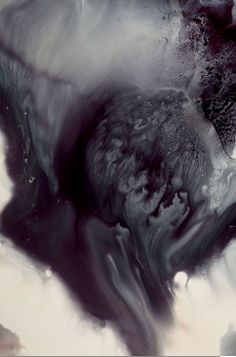 an abstract black and white painting with water