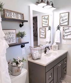 the bathroom is decorated in gray and white