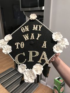 someone is holding up a graduation cap that says on my way to a cepa