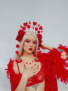 The love heart headdress is one of a kind love affair! Perfect for valentine's Day or festival season or any party were you want to share the love ❣️❣️❣️ The crown is enbelished with gold details as well as flowers and hand made pompoms. ❤️✨✨ This headdress has got a life garantie. Meaning if you break it you can sen it back to me and I will fix it for free!!  I am very active on my social media so if you want to ask any questions please contact me @lunie_blue or @lunablue.collection for more de Whimsical Red Headband Style Headpiece, Red Whimsical Headband Style Headpiece, Red Festival Crown Headpiece, Red Crown Headpieces For Party, Red Crown Headpiece For Parties, Red Round Crown For Party, Red Party Crown, Red Bohemian Headpiece For Party, Bohemian Red Headpiece For Party