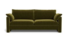 a green couch sitting on top of a white floor