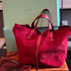 Used A Couple Of Times As An Evening Bag. Color: Ruby Red Suede And Red Metallic Leather - Reversible. Has Original Bag. Size; Approx. 17 Cm (H) X 35 Cm (W) (Bottom; Approx. 23 Cm X 12 Cm) Handle Height; Approx. 11cm Luxury Bag With Suede Lining, Luxury Shopping Bags With Suede Lining, Designer Burgundy Bag For Everyday, Luxury Reversible Shoulder Bag, Elegant Reversible Everyday Bags, Elegant Everyday Reversible Bags, Red Luxury Bags With Leather Handles, Luxury Red Bags With Leather Handles, Luxury Tote Bag With Suede Lining