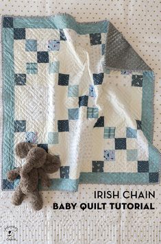 a teddy bear sitting on top of a quilt next to a baby quilt with the words irish chain