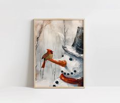 a painting of a snowman with a cardinal perched on it's head, in front of a white wall