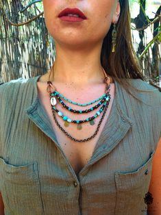 "Turquoise and brown exotic multi-layer necklace for women. Perfect for any occasion. It's made from Mexican leather that provides comfort to the skin. All 4 strands are in blue and earthy colors. The hook clasp on the side of the accessory makes it easy to open and close. GIFT WRAP INCLUDED! If you like my style, please have a look at my shop and see if there is something more you like. There are always discount in my shop if you purchase more items.. click on the link below and don't forget to Handmade Multi-strand Turquoise Necklace, Bohemian Multi-strand Adjustable Turquoise Necklace, Adjustable Multi-strand Bohemian Turquoise Necklace, Turquoise Bohemian Beaded Necklaces For Layering, Adjustable Bohemian Multi-strand Turquoise Necklace, Turquoise Bohemian Beaded Necklace For Layering, Adjustable Bohemian Layered Necklace For Beach, Turquoise Multi-strand Necklaces For Layering, Turquoise Multi-strand Bohemian Necklace