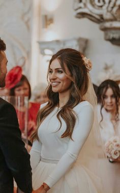 the bride and groom are smiling at each other