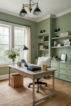 a home office with green walls and white furniture