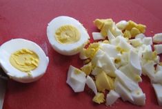 hard boiled eggs on a red cutting board