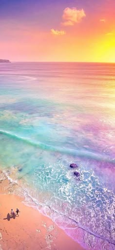 an aerial view of the beach and ocean at sunset