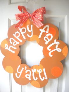 an orange and white happy birthday wreath hanging on a door with the words happy birthday ya'all