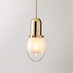 a light that is hanging from a rope on the ceiling with a bulb attached to it