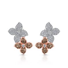 A brilliant addition to any fine jewelry lover, these double floral earrings are modern, feminine and eccentric. Each earring contains a larger floral with a smaller one placed behind it, making it seem as if the delicate flowers are climbing up your earlobe. Each flower is made up of sterling silver and decorated with white and chocolate stones.Carat Weight: 3.095 ctStone Size: 1,1.2,2,1,1.2,0.8,0.8 mmStone Type: Jeulia® StoneNumber of Stones: 270 Stone Shape: RoundStone Color: Diamond White, C Luxury Flower Shaped Pierced Earrings, Luxury Flower Cluster Earrings, Silver Earrings Online, Modern Feminine, White C, Silver Jewellery Sets, Delicate Flowers, Wedding Jewelry Sets, Delicate Flower