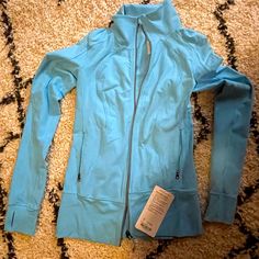 Lululemon Nice Asana Jacket In A Light Blue. New With Tags. Blue Spring Outerwear For Workout, Blue Spring Workout Outerwear, Spring Workout Blue Outerwear, Functional Blue Outerwear For Workout, Lululemon Rain Jacket, Lululemon Hoodie, Lululemon Scuba Hoodie, Lululemon Define Jacket, Lululemon Jacket