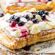 blueberry cream puff pastry with powdered sugar on top