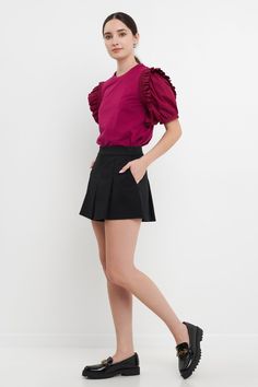 Our Ruffle Sleeve T-Shirt can pair with all of your favorite bottoms. The classic T-shirt you know and love is elevated with puffy sleeves that feature a prominent ruffle detail. Dress casually by styling this top with a pair of jeans and sneakers or dress this top up with a fun mini skirt and heels. Mixed media style Round neckline Ribbed neckline Puffy sleeves with ruffle detail Boxy fit Hand wash cold Do not bleach Do not tumble dry Iron low Exclusive of elastic Shell: 65% Polyester 35% Cotto Fitted Crew Neck T-shirt With Ruffles, Fitted Cotton T-shirt With Ruffle Sleeves, Non-stretch Ruffle Puff Sleeve Tops, Affordable Cotton T-shirt With Ruffle Sleeves, Feminine Ruffled Short Sleeve T-shirt, Puffy Sleeves, Ribbed Neckline, Round Neckline, Mini Skirt