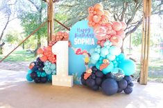 a birthday party with balloons and decorations in the shape of numbers 1, 2, 3, 4