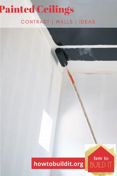 the ceiling is being painted with black paint and has a red stick sticking out of it