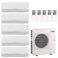 a group of air conditioners sitting next to each other in front of a white wall