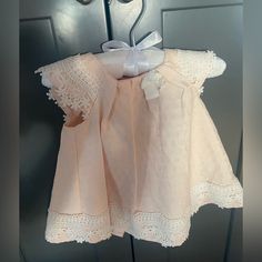 Adorable Baby Dress 6-9 Months Never Worn. Peachy Pink Color. Great For Easter! Buttons On Back And The Lace Detail Are So Cute! Cotton, Lace, Pearl Buttons, Pleated. Smoke Free, Pet Free Home! Fitted Sleeveless Pink Baptism Dress, Cute Peach Cotton Dress, Pink Baptism Dress For Spring, Cute Sleeveless Baptism Dress For First Birthday, Pink Cotton Dress For First Birthday, Fitted Pink Baptism Dress With Short Sleeves, Pink Short Sleeve Fitted Baptism Dress, Fitted Short Sleeve Pink Baptism Dress, Cute Cotton Baptism Dress With Short Sleeves