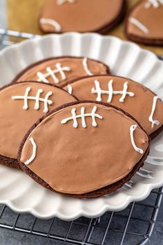 cookies decorated to look like footballs on a plate