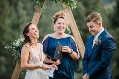 a bride and groom smile as they exchange vows