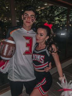 a man and woman dressed up as football players