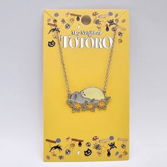 a yellow card with a necklace on it