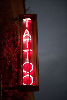 a red sign that is on the side of a building