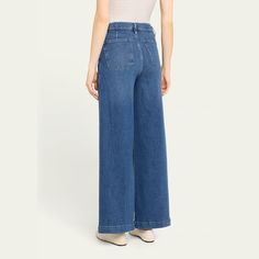 FRAME "Francoise" wide-leg jeans in faded medium-wash denim  Approx. 11" rise; 30" inseam High rise Four-pocket style Tailored fit Full length Extended button; belt loops Cotton/modal/elasterell-p Imported Medium Wash Wide Leg Flare Jeans With Belt Loops, Bergdorf Goodman, Wide Leg Jeans, Leg Jeans, Full Length, Tops Designs, Wide Leg, High Rise, Luxury Fashion