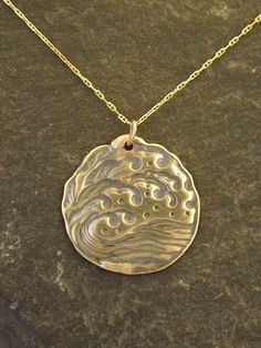 "The Wave pendant is 14K Gold. You may choose a 16\", 18\" or 20\" 14K Gold Chain as pictured. This Wave pendant measures 1\" in diameter. I hand cast all my pieces using the lost wax casting method. Please ask your needs. You may call me with questions, often I am out so please use my machine. 831-476-3176. Satisfaction Guaranteed! This piece is made and ready to ship This piece ships USPS First Class Insured I send items USPS First Class unless otherwise directed. I send as soon as I can, usua Lost Wax Casting Jewelry Pendants, Artisan Gold Custom Necklace Pendant, Artisan Gold Custom Pendant Necklace, Artisan Gold Pendant Custom Necklace, Gold Medallion Jewelry Hand Cast, Gold Hand Cast Brass Necklace, Gold Medallion Hand Cast Jewelry, Hand Cast Gold Brass Necklace, Artisan Gold Jewelry Hand Cast