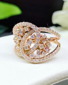 ENJOY OUR WORRY-FREE SERVICE AND THE DAZZLING, GENUINE JEWELRY WE DESIGN AND HANDCRAFT WITH LOVE❤️ ABOUT THE ITEM: HANDCRAFTED TO PERFECTION! SPECIAL DESIGN, CLUSTER BAGUETTE AND ROUND DIAMONDS! With 79 UNTREATED AND GENUINE F/VS QUALITY SPARKLING DIAMONDS! Perfect for every event! SET IN 18K SOLID ROSE GOLD HANDCRAFTED RING! SUGGESTED RETAIL VALUE: $4,800 DIAMONDS: 79 ROUND BRILLIANT, FULL CUT with excellent firing diamonds and delicate baguette, weighting at 1.08 carats. ALL NATURAL, UNTREATED Dazzling Rose Gold Baguette Cut Rings, Sparkling Rose Gold Fine Jewelry Rings, Rose Gold Cubic Zirconia Baguette Cut Rings, Rose Gold Rings With Baguette Diamonds For Anniversary, Party Rose Gold Diamond Ring, Sparkling Rose Gold Diamond Ring With Cubic Zirconia, Free Service, Rose Gold Engagement, Diamond Settings