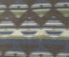 an area rug with different colors and patterns