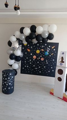 a space themed birthday party with balloons and decorations