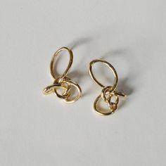 These face framing knots are funky and formal at the same time. Ready for your glam night out or a normal day at the office, you’re guaranteed to get compliments on these. Modern Twist Earrings For Formal Occasions, Loop Knot, Knot Earrings, Face Framing, Night Out, Yellow Gold, Gold