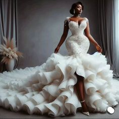 a woman in a wedding dress posing for the camera