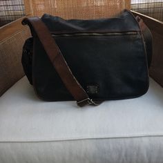 Beautiful Vachetta Men's Messenger Bag In Black And Dark Brown, Has Aged Super Well And Was Just Professionally Cleaned. The Bag Shows Very Little Wear On The Shoulder Strap And The Bag Lining Is Perfectly Clean. Perfect For Every Day Wear And This Type Of Leather Becomes More Luxurious Over Time. Men's Messenger Bag, Leather Messenger Bag Men, Bag Lining, Cole Haan Men, Messenger Bag Men, Leather Messenger Bag, Leather Messenger, Cole Haan, Leather Men