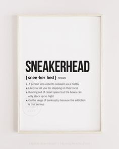 a white framed poster with the words sneakerhead in black on it's side