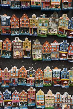 many different colored buildings are on display in a store window, and there is no image here to provide a caption for