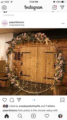 the instagram page shows an image of a wooden door decorated with flowers and fairy lights