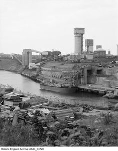 an old black and white photo of a river