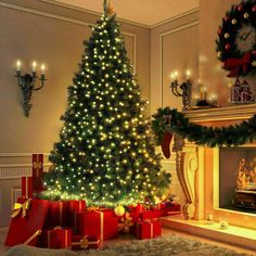 a decorated christmas tree in front of a fireplace