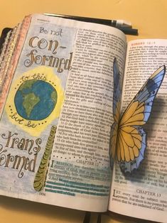 an open book with a butterfly on it