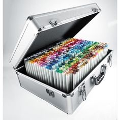 an open suitcase filled with colored crayons on top of each other in front of a white background